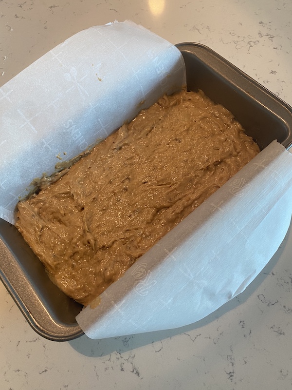 Pouring batter into loaf tray for Einkorn Banana Bread